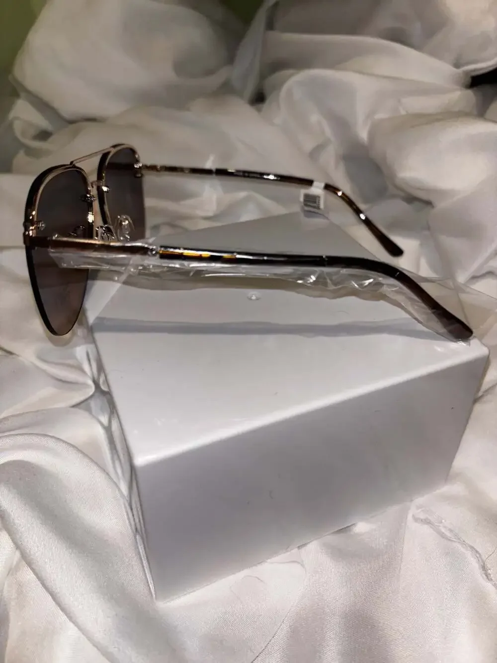 Ashley Stewart Rimless Aviator Sunglasses in Brown